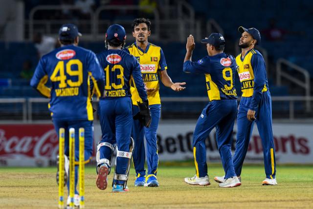 Maheesh Theekshana (3L) of Sri Lanka celebrates the dismissal of Akeem Auguste of West Indies during the third Twenty20 (T20) international cricket match between West Indies and Sri Lanka at Sabina Park in Kingston, Jamaica, on June 14, 2026. (Photo by Randy Brooks / AFP)