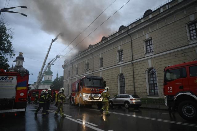 Firefighters work to control a blaze at the Mystetskyi Arsenal National Art and Culture Museum Complex, Ukraine's flagship public cultural institution, following a Russian missile strike in Kyiv on June 15, 2026, amid the Russian invasion in Ukraine. Russia fired a barrage of missiles at several major Ukrainian cities, setting Kyiv's historic Dormition Cathedral on fire and killing nine, while Ukraine strikes claimed three lives south of Moscow. (Photo by Genya Savilov / AFP)