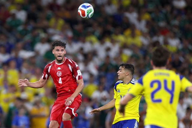 Tunisia's defender #04 Omar Rekik heads the ball during the 2026 World Cup Group F football match between Sweden and Tunisia at the Monterrey Stadium in Guadalupe on June 14, 2026.  (Photo by Julio Cesar AGUILAR / AFP)
