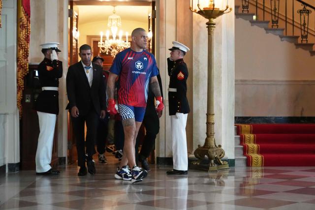 Brazil's mixed martial artist Alex Pereira walks through the Grand Foyer of the White House before his heavyweight interim title bout with France's mixed martial artist Ciryl Gane, during UFC Freedom 250 on the South Lawn of the White House, in Washington, DC, on June 14, 2026. (Photo by Jacquelyn Martin / POOL / AFP)