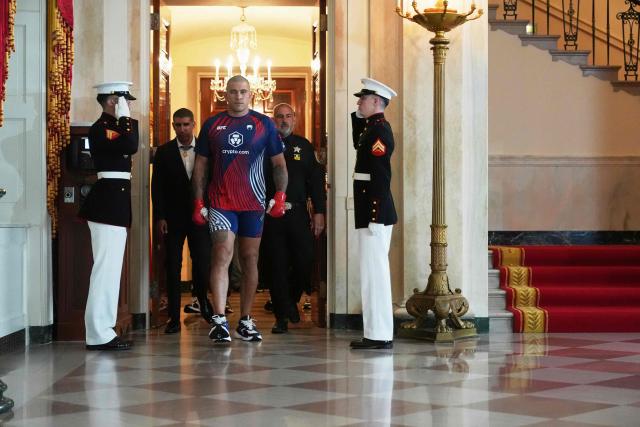 Brazil's mixed martial artist Alex Pereira walks through the Grand Foyer of the White House before his heavyweight interim title bout with France's mixed martial artist Ciryl Gane, during UFC Freedom 250 on the South Lawn of the White House, in Washington, DC, on June 14, 2026. (Photo by Jacquelyn Martin / POOL / AFP)