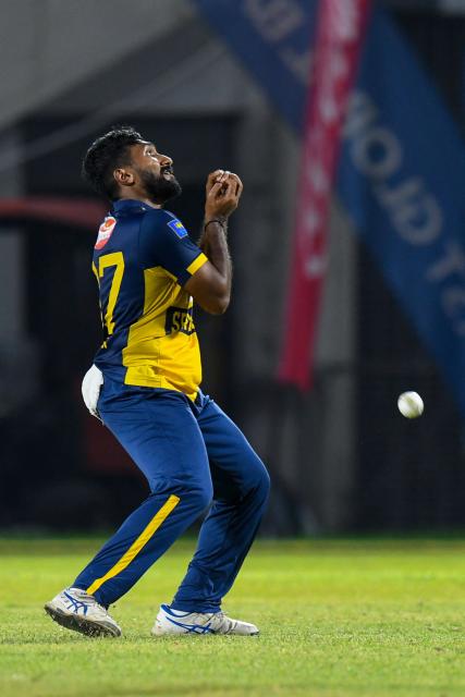 Eshan Malinga of Sri Lanka drops Sherfane Rutherford of West Indies during the third Twenty20 (T20) international cricket match between West Indies and Sri Lanka at Sabina Park in Kingston, Jamaica, on June 14, 2026. (Photo by Randy Brooks / AFP)