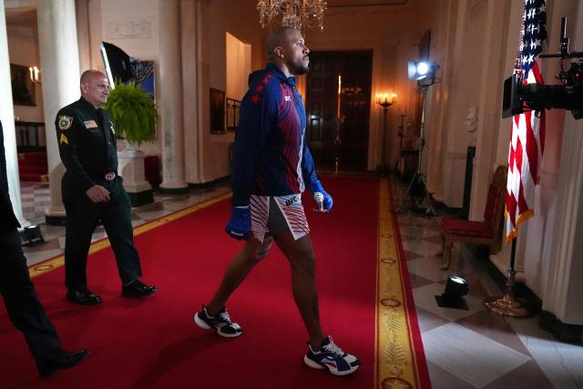 France's mixed martial artist Ciryl Gane walks through the White House before his heavyweight interim title bout with Brazil's mixed martial artist Alex Pereira, during UFC Freedom 250 on the South Lawn of the White House, in Washington, DC, on June 14, 2026. (Photo by Jacquelyn Martin / POOL / AFP)