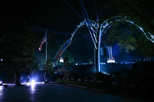 Guests walk around during the "UFC Freedom 250" mixed martial arts event on the South Lawn of the White House in Washington, DC, on June 14, 2026. (Photo by Brendan SMIALOWSKI / AFP)