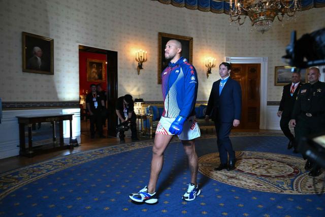 France's Ciryl Gane walks through the Blue Room of the White House before his fight against Brazil's Alex Pereira during the "UFC Freedom 250" mixed martial arts event on the South Lawn of the White House in Washington, DC, June 14, 2026. (Photo by SAUL LOEB / POOL / AFP)