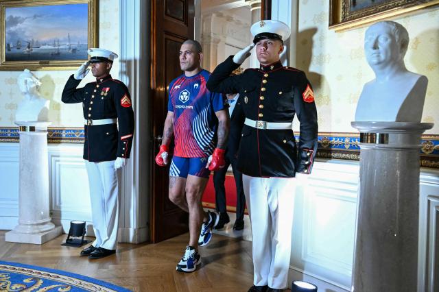 Brazil's Alex Pereira walks through the Blue Room of the White House before his fight against France's Ciryl Gane during the "UFC Freedom 250" mixed martial arts event on the South Lawn of the White House in Washington, DC, June 14, 2026. (Photo by SAUL LOEB / POOL / AFP)