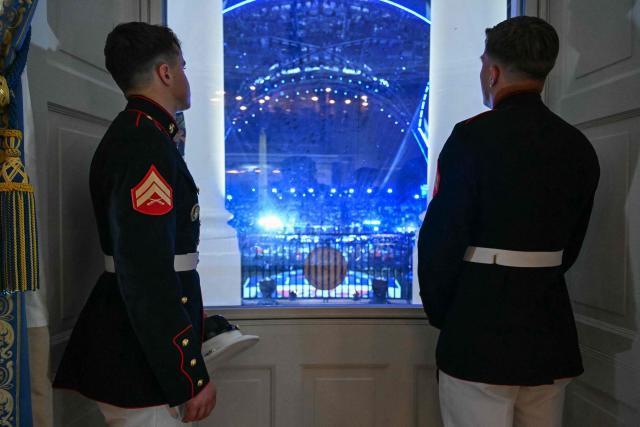 US Marines watch from the Blue Room of the White House during the "UFC Freedom 250" mixed martial arts event on the South Lawn of the White House in Washington, DC, June 14, 2026. (Photo by SAUL LOEB / POOL / AFP)