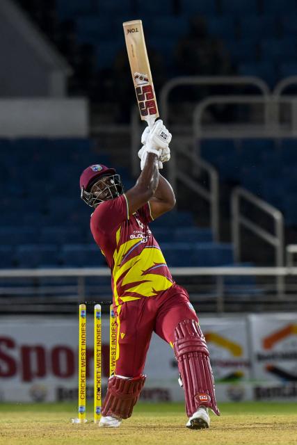 Rovman Powell of West Indies hits 6 during the third Twenty20 (T20) international cricket match between West Indies and Sri Lanka at Sabina Park in Kingston, Jamaica, on June 14, 2026. (Photo by Randy Brooks / AFP)