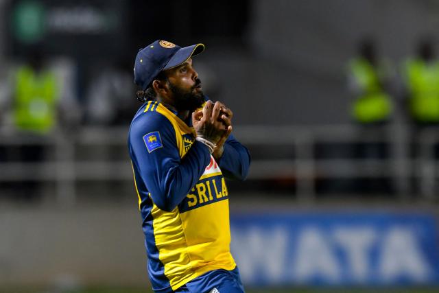 Wanindu Hasaranga of Sri Lanka takes the catch to dismiss Rovman Powell of West Indies during the third Twenty20 (T20) international cricket match between West Indies and Sri Lanka at Sabina Park in Kingston, Jamaica, on June 14, 2026. (Photo by Randy Brooks / AFP)