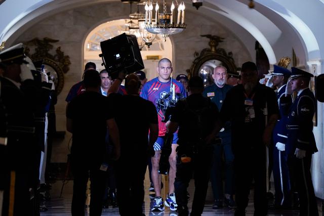 Brazil's mixed martial artist Alex Pereira walks through a White House hallway to his bout during UFC Freedom 250 in Washington, DC, on June 14, 2026. (Photo by Elizabeth Frantz / POOL / AFP)