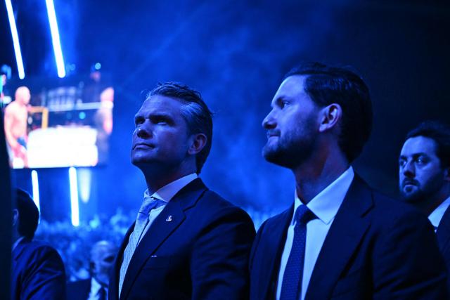 US Secretary of Defense Pete Hegseth (L) attends the "UFC Freedom 250" mixed martial arts event on the South Lawn of the White House in Washington, DC, June 14, 2026. (Photo by Kent NISHIMURA / AFP)