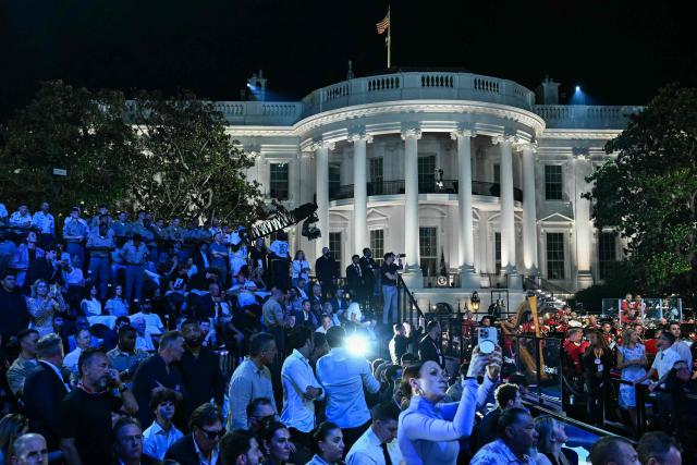 Spectators watch during the "UFC Freedom 250" mixed martial arts event on the South Lawn of the White House in Washington, DC, June 14, 2026. (Photo by Kent NISHIMURA / AFP)