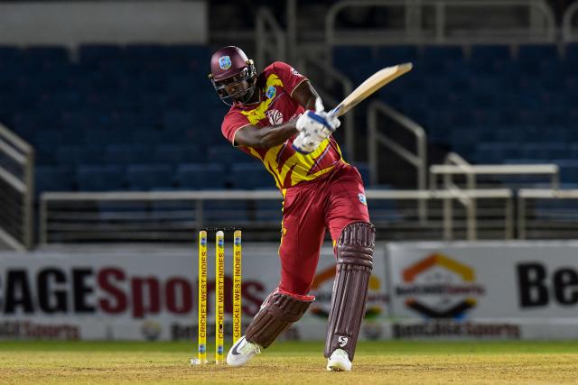 Jason Holder of West Indies hits 6 during the third Twenty20 (T20) international cricket match between West Indies and Sri Lanka at Sabina Park in Kingston, Jamaica, on June 14, 2026. (Photo by Randy Brooks / AFP)