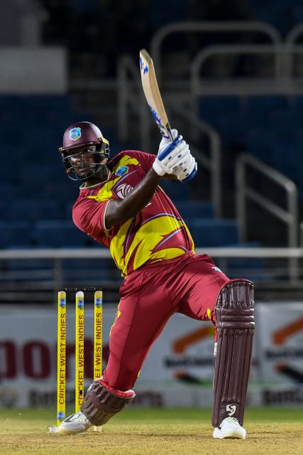 Jason Holder of West Indies hits 6 during the third Twenty20 (T20) international cricket match between West Indies and Sri Lanka at Sabina Park in Kingston, Jamaica, on June 14, 2026. (Photo by Randy Brooks / AFP)