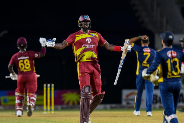Jason Holder of West Indies celebrates winning the third Twenty20 (T20) international cricket match between West Indies and Sri Lanka at Sabina Park in Kingston, Jamaica, on June 14, 2026.  (Photo by Randy Brooks / AFP)