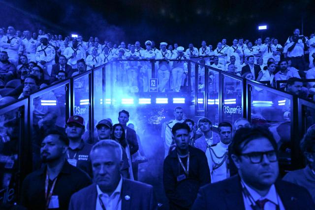 Spectators and members of the US military watch during the "UFC Freedom 250" mixed martial arts event on the South Lawn of the White House in Washington, DC, in the early hours of June 15, 2026. (Photo by Kent NISHIMURA / AFP)
