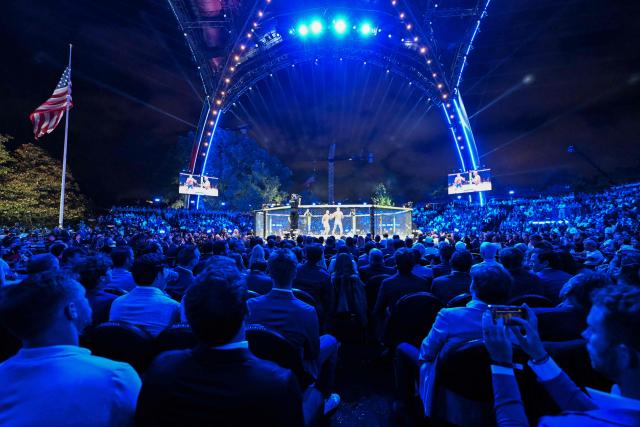 Spectators watch the fight between France's Ciryl Gane and Brazil's Alex Pereira during "UFC Freedom 250" mixed martial arts event on the South Lawn of the White House in Washington, DC, in the early hours of June 15, 2026. (Photo by Kent NISHIMURA / AFP)
