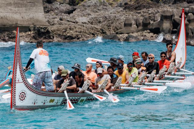 Crew members test-row a traditional wooden canoe called Ovayan (Golden Friendship) off Orchid island (or Lanyu island), southeastern Taiwan on June 14, 2026, on the eve of its planned voyage to Philippines' Batanes Islands. (Photo by CHENG Yu-chen / AFP)