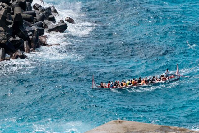 Crew members test-row a traditional wooden canoe called Ovayan (Golden Friendship) off Orchid island (or Lanyu island), southeastern Taiwan on June 14, 2026, on the eve of its planned voyage to Philippines' Batanes Islands. (Photo by CHENG Yu-chen / AFP)