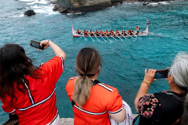 The Tao (Yami) indigenous rowers paddle a traditional wooden canoe called Ovayan (Golden Friendship) during its voyage to Philippines' Batanes Islands, along the coastline at Orchid island (or Lanyu island), southeastern Taiwan on June 15, 2026. (Photo by CHENG Yu-chen / AFP)