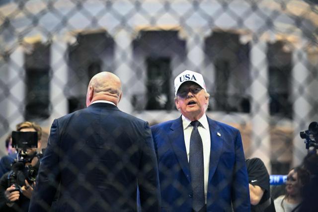 US President Donald Trump stands in The Octagon with UFC CEO Dana White at the conclusion of the "UFC Freedom 250" mixed martial arts event on the South Lawn of the White House in Washington, DC, in the early morning hours of June 15, 2026. (Photo by Kent NISHIMURA / AFP)