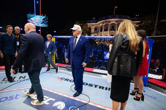 US President Donald Trump, US First Lady Melania Trump, UFC CEO Dana White and other guests gather inside the Octagon at UFC Freedom 250 on the South Lawn of the White House in Washington, DC, on June 15, 2026. (Photo by Evan Vucci / POOL / AFP)