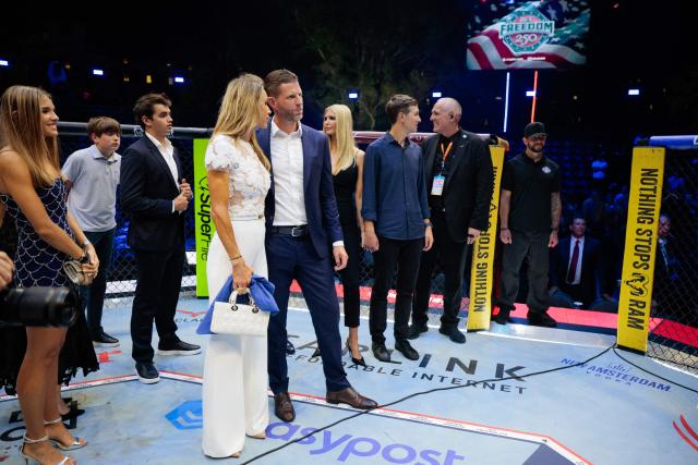 Eric Trump, Lara Trump and other guests gather inside the Octagon at UFC Freedom 250 on the South Lawn of the White House in Washington, DC, on June 15, 2026. (Photo by Evan Vucci / POOL / AFP)