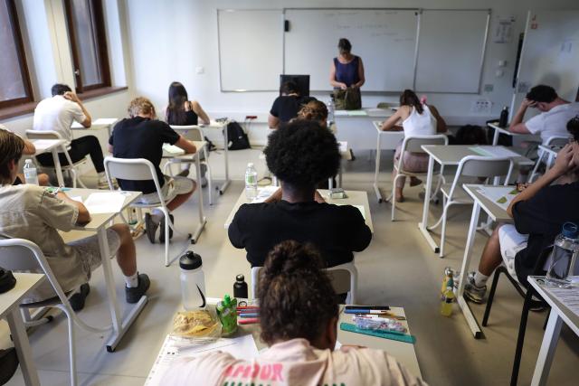 Students start working as a 4 hours philosophy dissertation kicks off the French general baccalaureat exam for getting into university, at Bellevue high school, in Toulouse, south-western France on June 15, 2026. More than 700,000 candidates across France take the 2026 session of the Baccalaureat or "bac", the secondary school diploma required for access to higher education, with written exams running from June 15 to 18 and oral examinations through early July. (Photo by Valentine CHAPUIS / AFP)