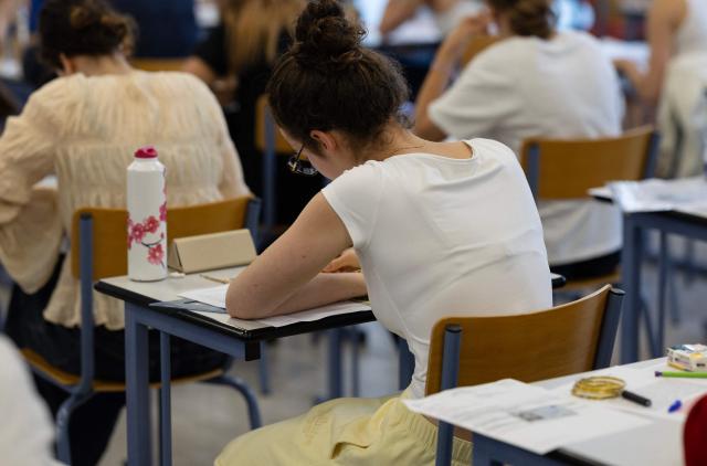 A student works as a 4 hours philosophy dissertation kicks off the French general baccalaureat exam for getting into university, in Quimper on June 15, 2026. More than 700,000 candidates across France take the 2026 session of the Baccalaureat or "bac", the secondary school diploma required for access to higher education, with written exams running from June 15 to 18 and oral examinations through early July. (Photo by Fred TANNEAU / AFP)