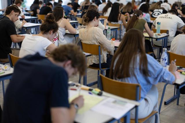 Students start working as a 4 hours philosophy dissertation kicks off the French general baccalaureat exam for getting into university, in Quimper on June 15, 2026. More than 700,000 candidates across France take the 2026 session of the Baccalaureat or "bac", the secondary school diploma required for access to higher education, with written exams running from June 15 to 18 and oral examinations through early July. (Photo by Fred TANNEAU / AFP)