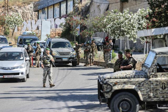 Lebanese soldiers man a checkpoint at the entrance to Nabatieh on June 15, 2026. The United States and Iran said they reached a deal to end the Middle East war on all fronts including Lebanon, and reopen the vital Strait of Hormuz, but offered little indication on the thorny question of Tehran's nuclear programme. Washington and Islamabad said the agreement was to be signed on June 19 in Switzerland, signalling what would be a major breakthrough to ending months of war that have taken thousands of lives and roiled energy markets. (Photo by MAHMOUD ZAYYAT / AFP) / 