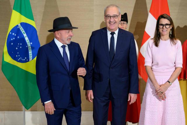 Swiss Federal President Guy Parmelin (C), Brazil's President Luiz Inacio Lula da Silva (L) and President of the Council of State of Geneva Anne Hiltpold pose upon arrival for a meeting ahead of the G7 summit, in Evian, eastern France, on June 15, 2026. A G7 summit is set to take place June 15 to 17 in the French town of Evian-les-Bains near Switzerland and it will be attended by country leaders as well as the EU's foreign policy chief and ministers from Brazil, Canada, the United Arab Emirates and Turkey. (Photo by LAURENT GILLIERON / POOL / AFP)