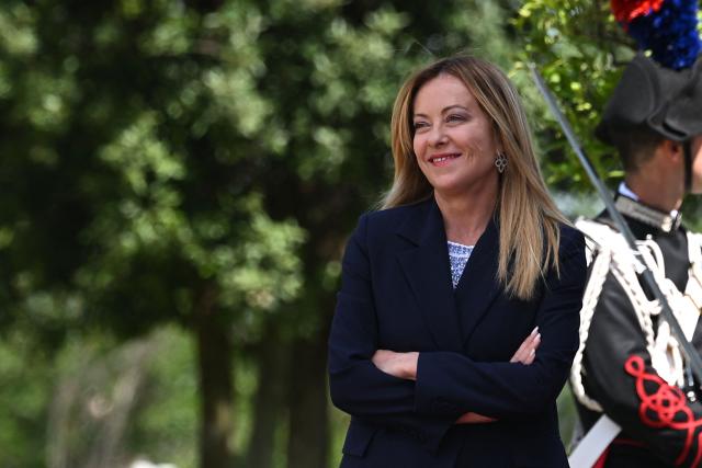 Italy's Prime Minister, Giorgia Meloni stands as she welcomes Japan's Prime Minister before a meeting at Villa Doria Pamphili in Rome on June 15, 2026. (Photo by Andreas SOLARO / AFP)