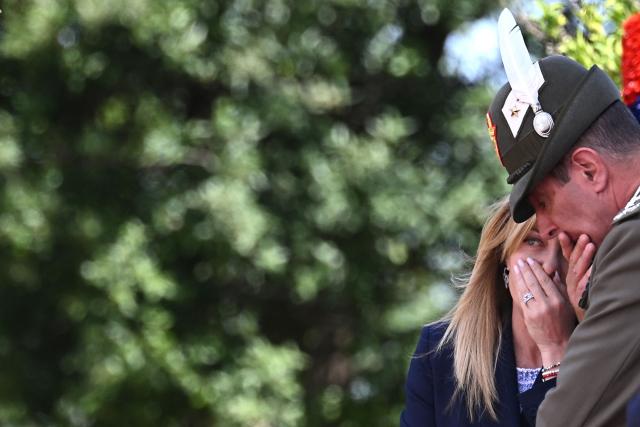 Italy's Prime Minister Giorgia Meloni (L) speaks with her military advisor before a meeting with Japan's Prime Minister at Villa Doria Pamphili in Rome on June 15, 2026. (Photo by Andreas SOLARO / AFP)