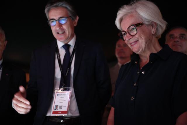 France's Defence Minister Catherine Vautrin (R) listens to Chief Executive Officer of French aerospace and defence group Thales, Patrice Caine (L) at the Thales stand at the Eurosatory land and airland defence and security trade fair, at the Paris-Nord Villepinte Exhibition Centre in Villepinte, north of Paris, on June 15, 2026. (Photo by Guillaume BAPTISTE / AFP)