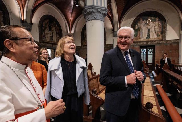 Germany's President Frank-Walter Steinmeier (R) and First Lady Elke Buedenbender (C) are guided by Cardinal Ignatius Suharyo Hardjoatmodjo, the Archbishop of Jakarta, during a visit to Jakarta Cathedral in Jakarta on June 15, 2026. (Photo by Yasuyoshi Chiba / AFP)