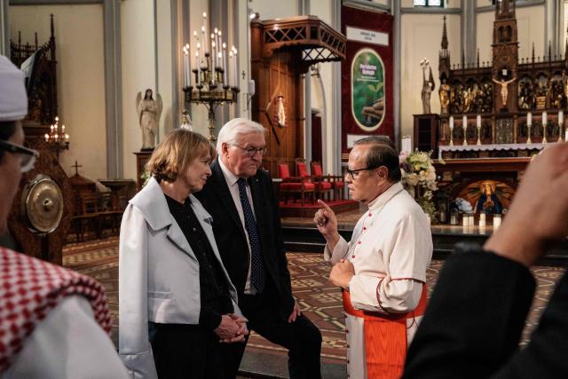 Germany's President Frank-Walter Steinmeier (C) and First Lady Elke Buedenbender (L) are guided by Cardinal Ignatius Suharyo Hardjoatmodjo, the Archbishop of Jakarta, during a visit to Jakarta Cathedral in Jakarta on June 15, 2026. (Photo by Yasuyoshi Chiba / AFP)