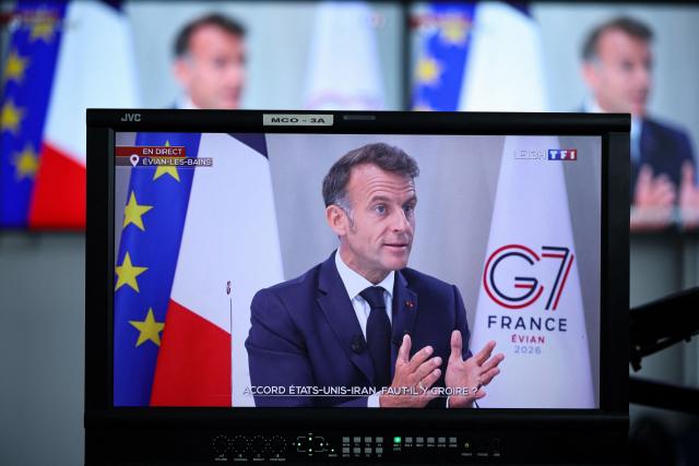 This photograph shows France's President Emmanuel Macron speaking during an interview as part of French TV channel TF1's news broadcast on the sidelines of the G7 summit, in Evian, central-eastern France on June 15, 2026. A G7 summit is set to take place June 15 to 17 in the French town of Evian-les-Bains near Switzerland and it will be attended by country leaders as well as the EU's foreign policy chief and ministers from Brazil, Canada, the United Arab Emirates and Turkey. (Photo by SIMON WOHLFAHRT / AFP)