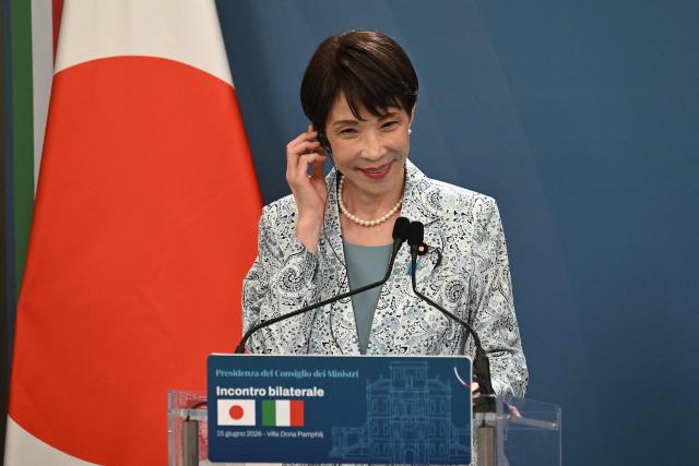 Japan's Prime Minister Sanae Takaichi listens to Italy's Prime Minister during a press conference following a meeting at Villa Doria Pamphili in Rome on June 15, 2026. (Photo by Andreas SOLARO / AFP)