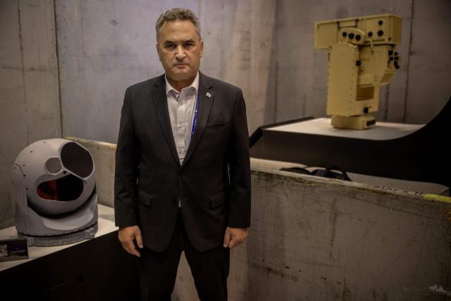 Israel's ambassador to France Joshua Zarka poses during a photo session at the stand of Israeli developer and manufacturer of defence and surveillance Electro-optic infrared (EO/IR) systems Controp that was later closed by organisers at the Eurosatory land and airland defence and security trade fair, at the Paris-Nord Villepinte Exhibition Centre in Villepinte, north of Paris on June 15, 2026. Twelve Israeli stands were closed at the Eurosatory defence and security exhibition, which opened on today, for failing to comply with the conditions that had been set, according to a statement received by AFP from the organising company, Coges Events. (Photo by Guillaume BAPTISTE / AFP)