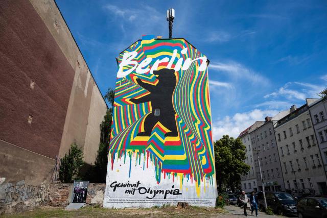 A mural, part of the city of Berlin's campaign to host the Olympic Games in 2036, 2040, or 2044, reads: "Berlin wins with Olympia", in Berlin on June 15, 2026. (Photo by John MACDOUGALL / AFP)