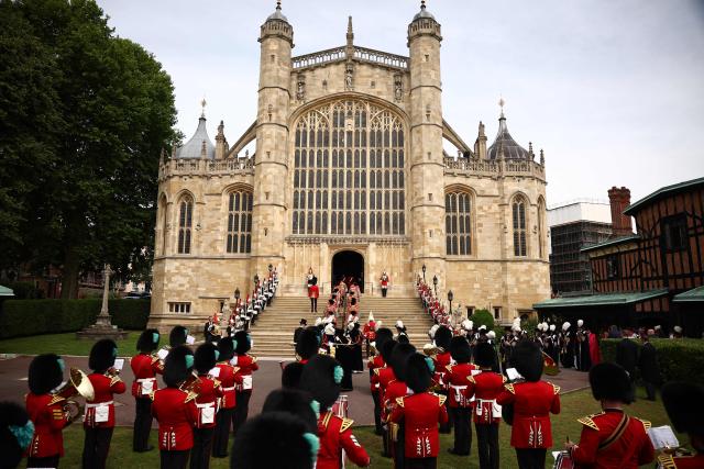 The Band of the Irish Guards play as attendees arrive  for the Order of the Garter service at St. George's Chapel in Windsor Castle, west of London, on June 15, 2026. The Order of the Garter is the oldest and most senior Order of Chivalry in Britain, established by King Edward III nearly 700 years ago. (Photo by HENRY NICHOLLS / POOL / AFP)