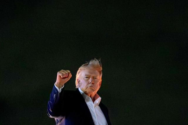 US President Donald Trump clenches his fist as he makes his way to board Air Force One before departing Joint Base Andrews in Maryland on June 15, 2026, to attend the G7 summit in the French town of Evian-les-Bains near Switzerland. Trump is heading to Evian, France to attend the G7 Summit. Allies from the G7 group of leading powers will seek common ground with US President at a summit in France that gets underway hours after the US and Iran agreed a deal to end the Middle East war. (Photo by Mandel NGAN / AFP)