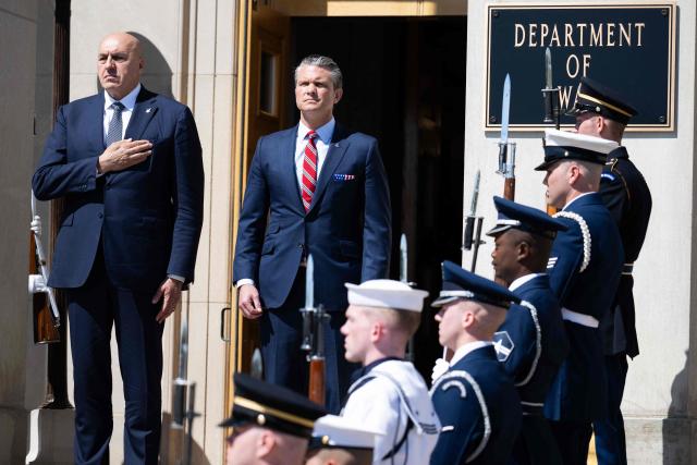 US Secretary of Defense Pete Hegseth and Italian Defense Minister Guido Crosetto (L), listen as national anthems are played during an honor cordon welcoming ceremony at the Pentagon in Washington, DC on June 15, 2026. (Photo by SAUL LOEB / AFP)
