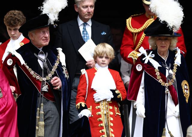 Britain's King Charles III and Britain's Queen Camilla leave after attending the Order of the Garter service at St. George's Chapel in Windsor Castle, west of London, on June 15, 2026. The Order of the Garter is the oldest and most senior Order of Chivalry in Britain, established by King Edward III nearly 700 years ago. (Photo by Henry NICHOLLS / POOL / AFP)