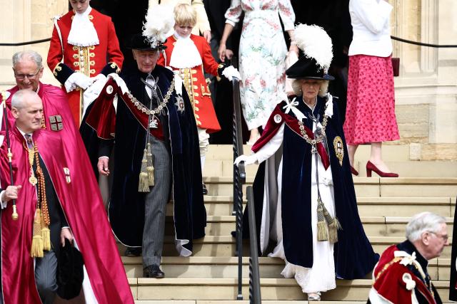 Britain's King Charles III and Britain's Queen Camilla leave after attending the Order of the Garter service at St. George's Chapel in Windsor Castle, west of London, on June 15, 2026. The Order of the Garter is the oldest and most senior Order of Chivalry in Britain, established by King Edward III nearly 700 years ago. (Photo by Henry NICHOLLS / POOL / AFP)