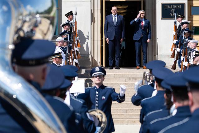 US Secretary of Defense Pete Hegseth and Italian Defense Minister Guido Crosetto (L), listen as national anthems are played during an honor cordon welcoming ceremony at the Pentagon in Washington, DC on June 15, 2026. (Photo by SAUL LOEB / AFP)