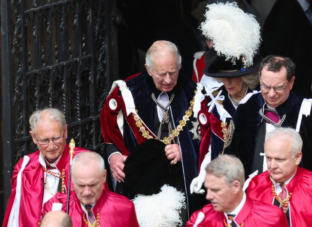 Britain's King Charles III (top L) and Britain's Queen Camilla (top C) depart after attending the annual Order of the Garter service at St. George's Chapel in Windsor Castle, west of London, on June 15, 2026. The Order of the Garter is the oldest and most senior Order of Chivalry in Britain, established by King Edward III nearly 700 years ago. (Photo by Toby Shepheard / POOL / AFP)