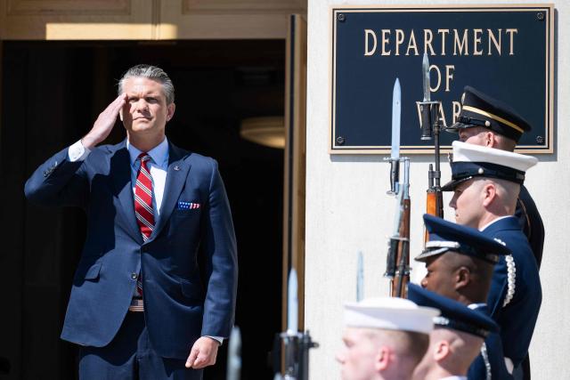 US Secretary of Defense Pete Hegseth listens as national anthems are played during an honor cordon welcoming ceremony for Italian Defense Minister Guido Crosetto at the Pentagon in Washington, DC on June 15, 2026. (Photo by SAUL LOEB / AFP)