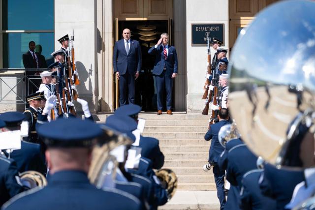 US Secretary of Defense Pete Hegseth and Italian Defense Minister Guido Crosetto (L), listen as national anthems are played during an honor cordon welcoming ceremony at the Pentagon in Washington, DC on June 15, 2026. (Photo by SAUL LOEB / AFP)